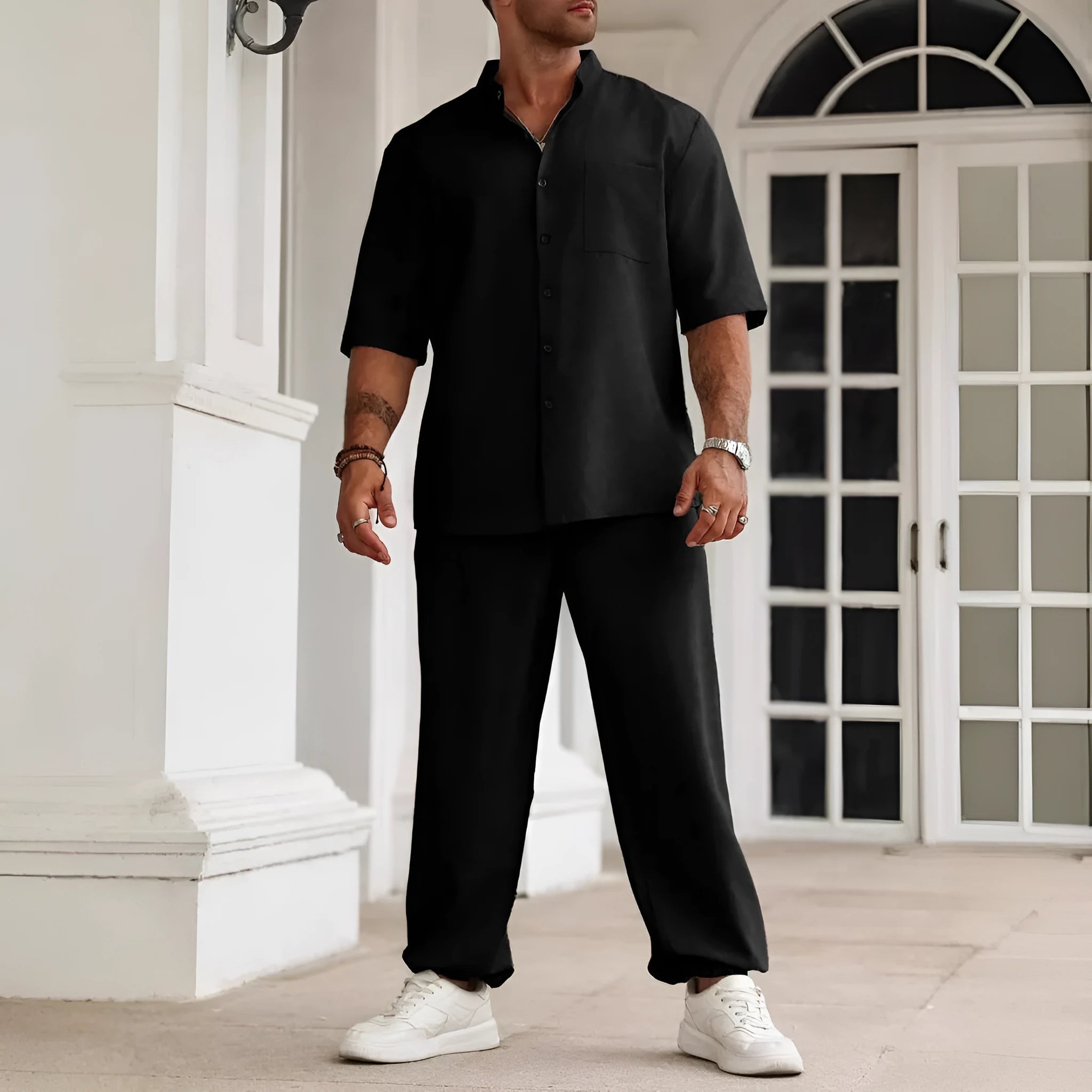 Men's apricot coloured cotton linen casual short-sleeved shirt and matching trousers laid flat.