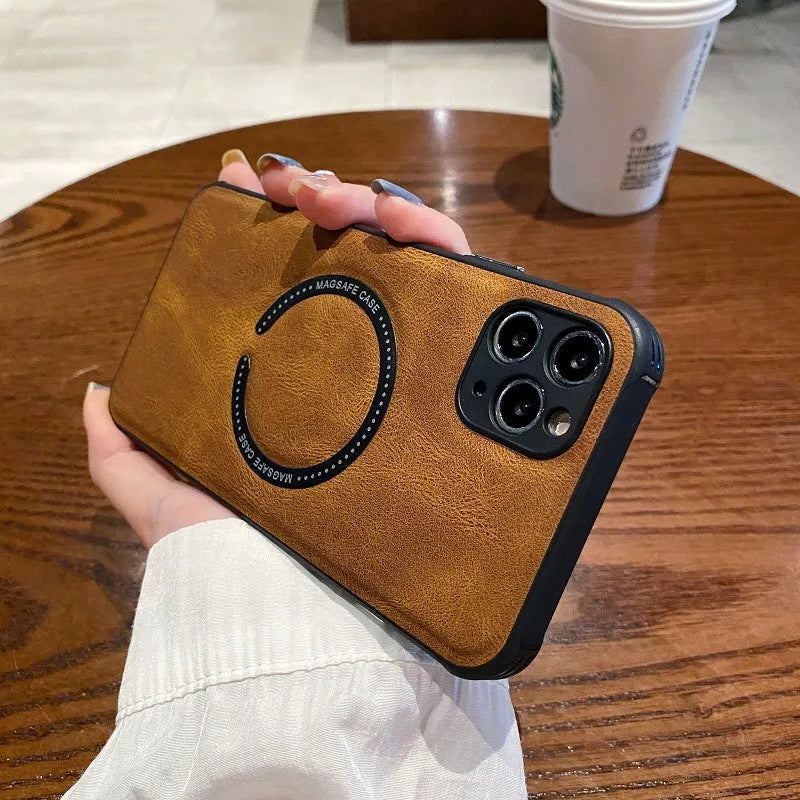 Black imitation leather magnetic charging case for iPhone on a magnetic charging puck