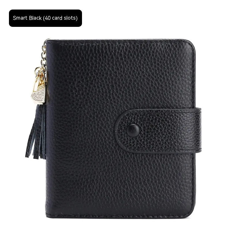 Large capacity genuine cowhide leather card holder wallet with tassel, snap closure, 40 card slots, and ID holder