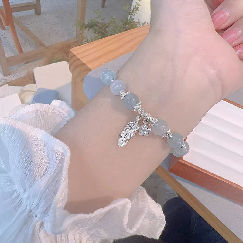 Korean style glass bracelet with feather XINGX blue moonlight colour and eight Awn star decorative elements