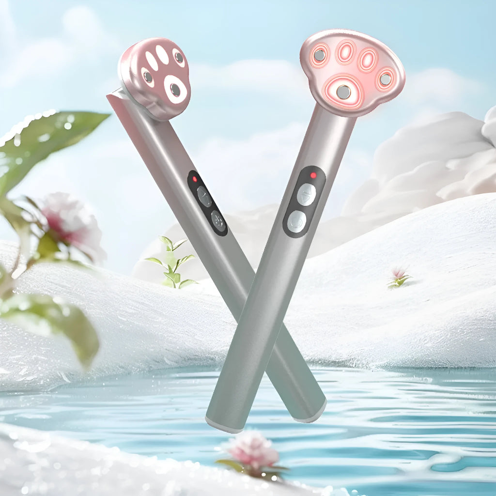 Gradient pink Cat's Paw shape micro-current eye massager with colour light therapy on a white background.