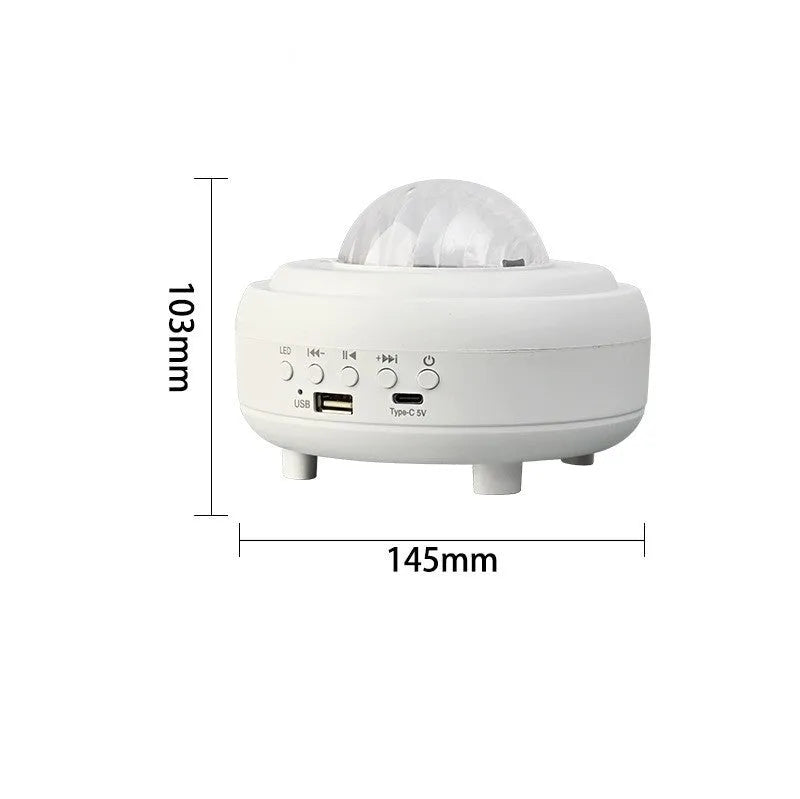 White Galaxy Star Projector on bedside table projecting blue star patterns on wall