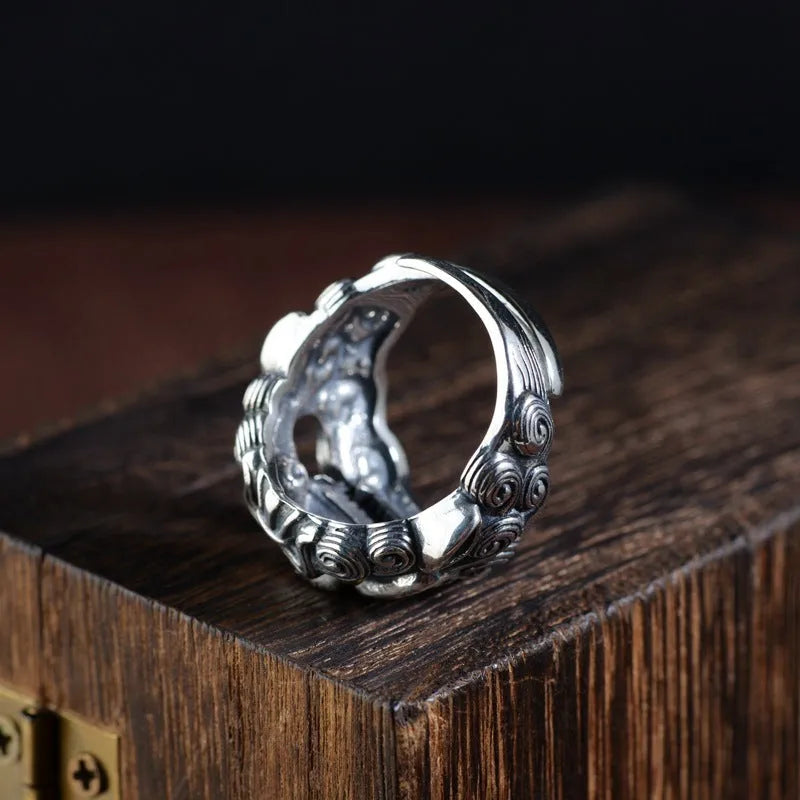 Adjustable open-style sterling silver ring with Jibeast zodiac pattern and diamond accents on finger