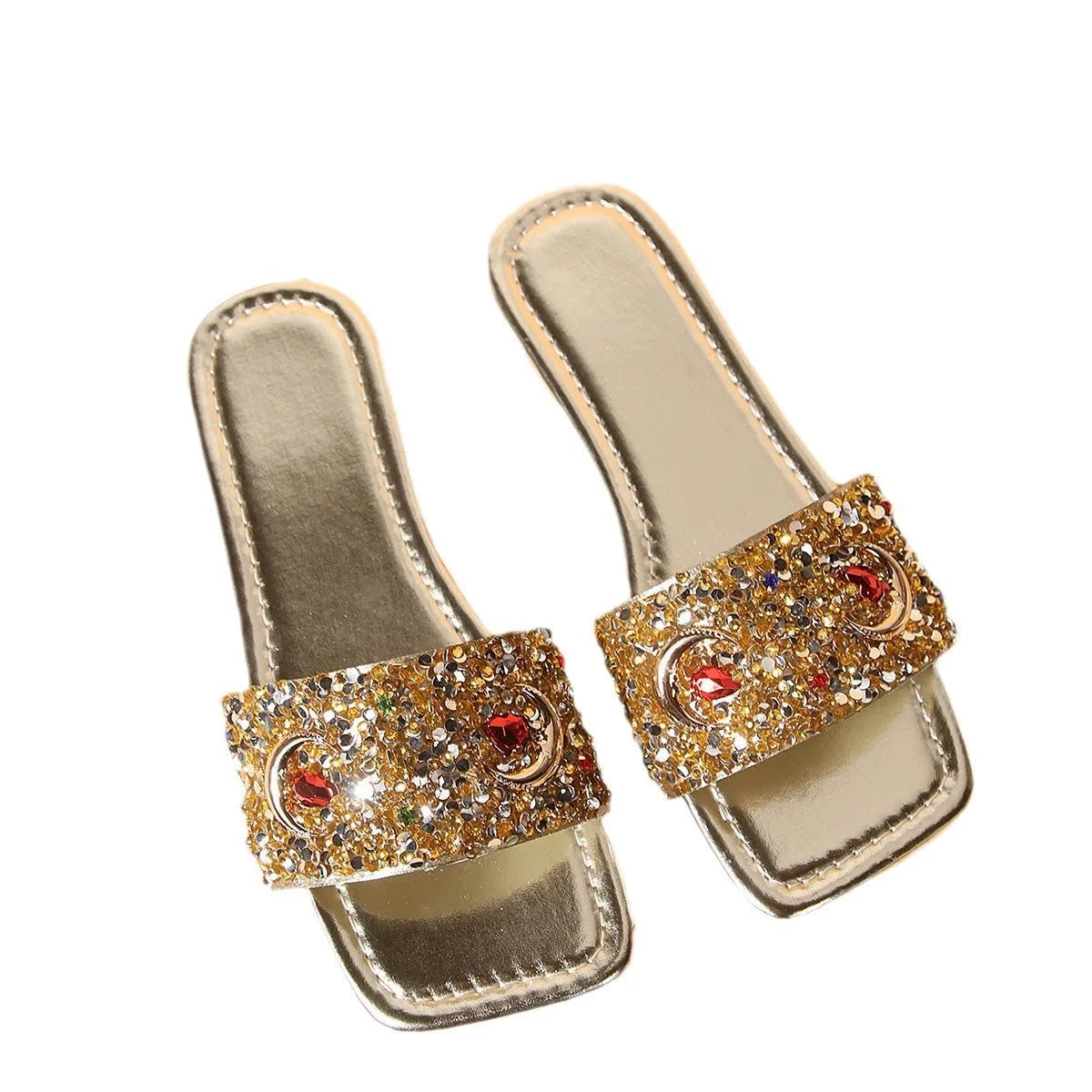 Gold women's flat slippers decorated with rhinestones and sequins on a PU upper with a rubber sole.