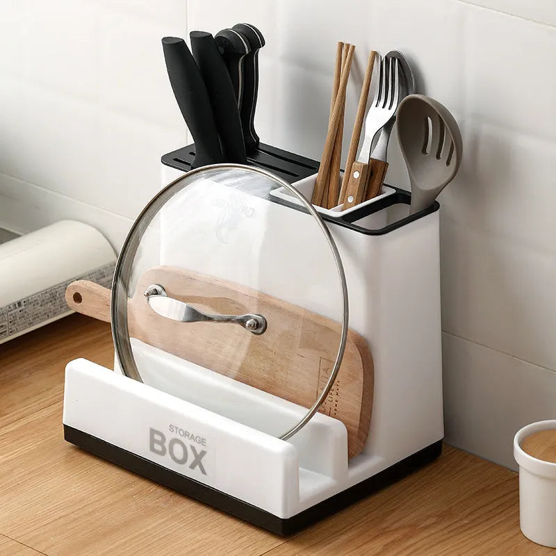 White plastic kitchen knife storage rack with integrated shelf for desktop organisation