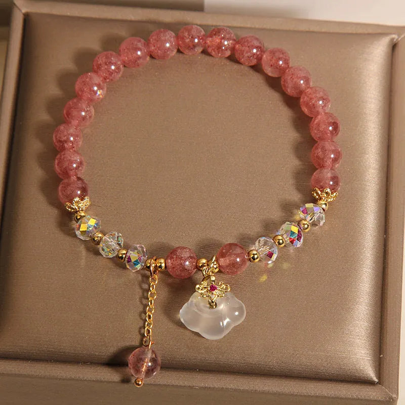 Women's strawberry quartz and white agate crystal bracelet with auspicious clouds charm.