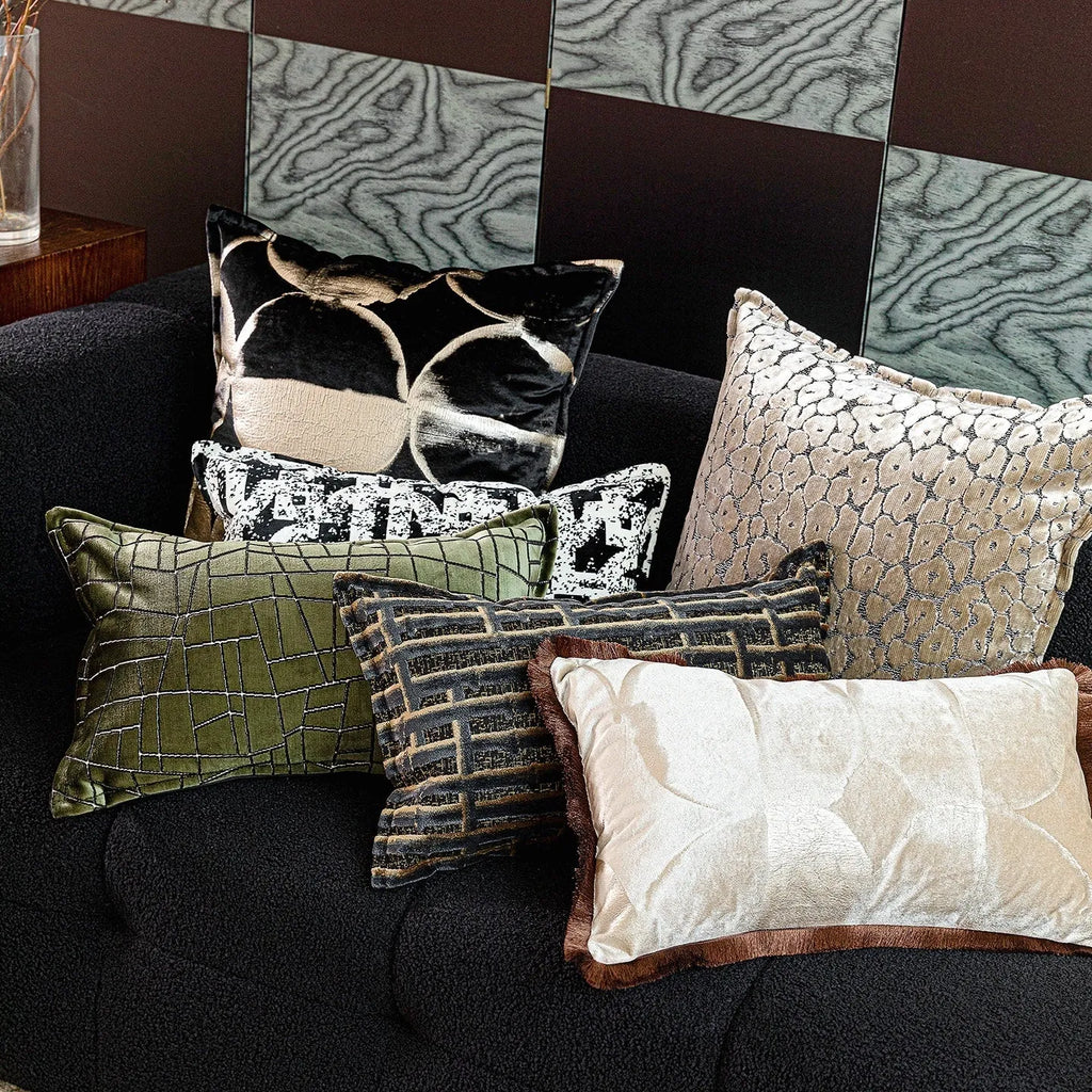 Black gold abstract pattern cushion with removable cover in three size options on furniture