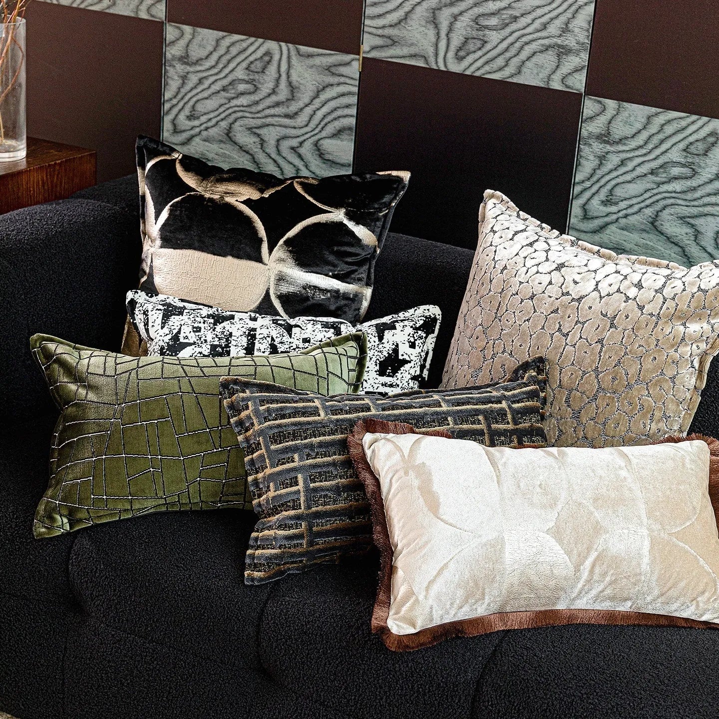 Black gold abstract pattern cushion with removable cover in three size options on furniture