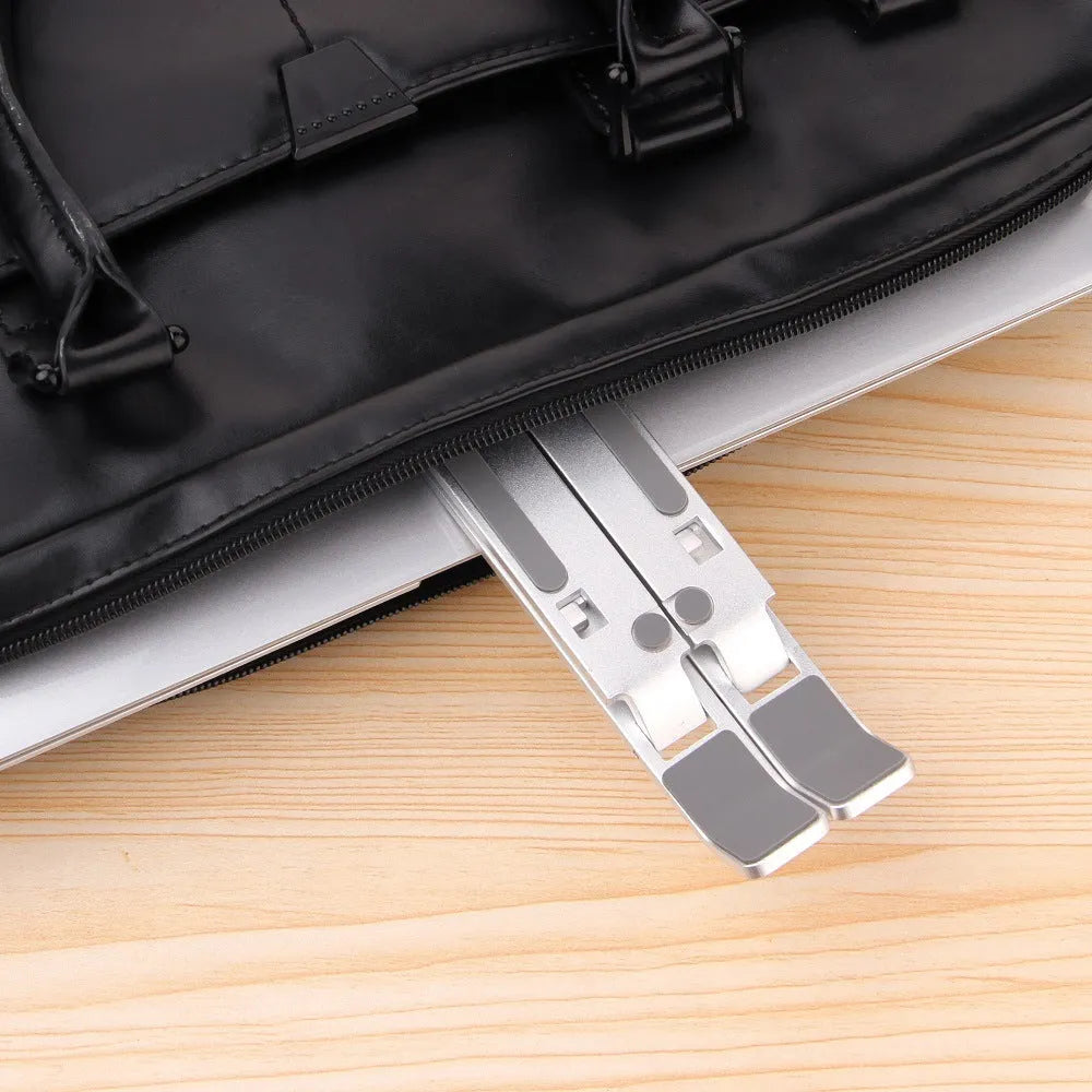 Silver folding computer stand in aluminium alloy with silicone points for laptops under 16 inches