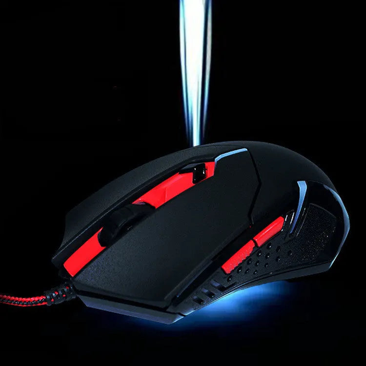 Black and red wired USB ergonomic gaming mouse on a desk.