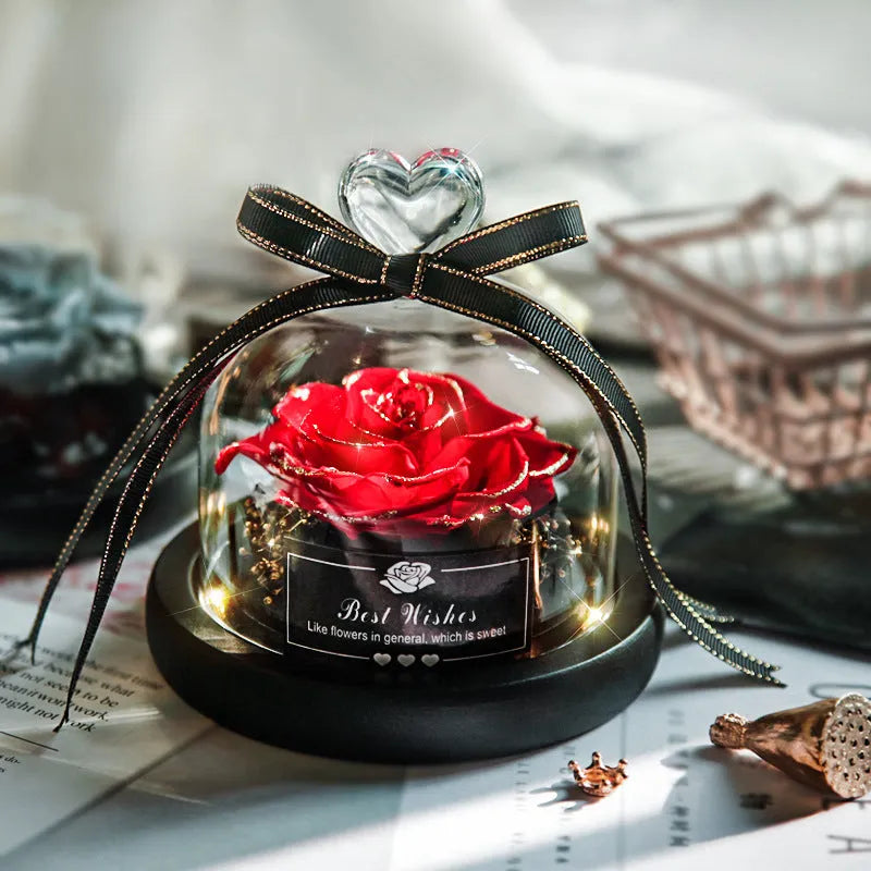 Eternal real rose with LED light inside a 13x13x12cm transparent glass dome, available in multiple colours