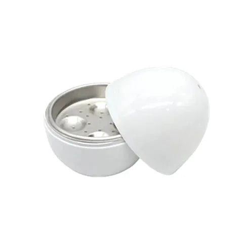 White microwave egg cooker steamer with capacity for four eggs, showing vent hole and knob.