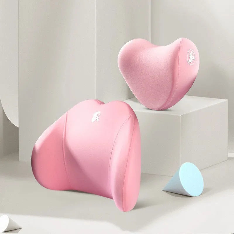Heart-shaped black and grey car pillow set for headrest and lumbar support on a car seat.