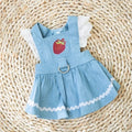Bondi blue denim skirt for dogs with a strawberry print, shown on a small dog.