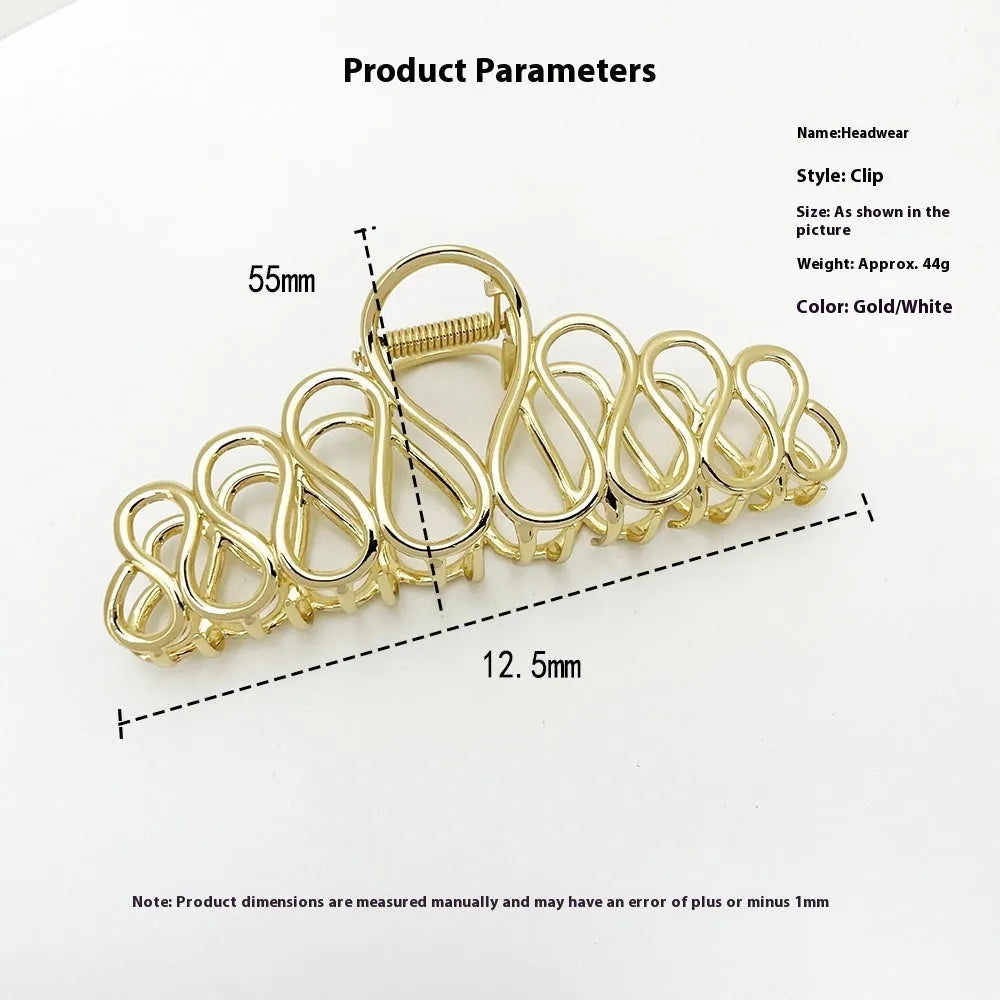 Minimalist large alloy hair clip with tassel in gold or silver for updo hairstyles.