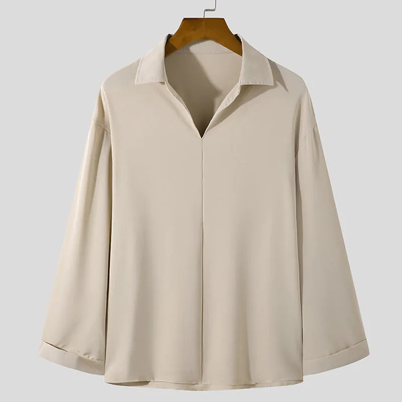 Men's loose fit long sleeve casual business shirt in a solid colour on a hanger