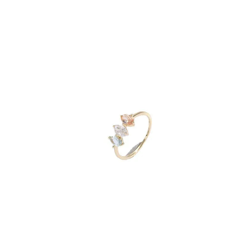 Geometric horse eye ring with tricolour zircon stones on a 14k gold-plated copper band.