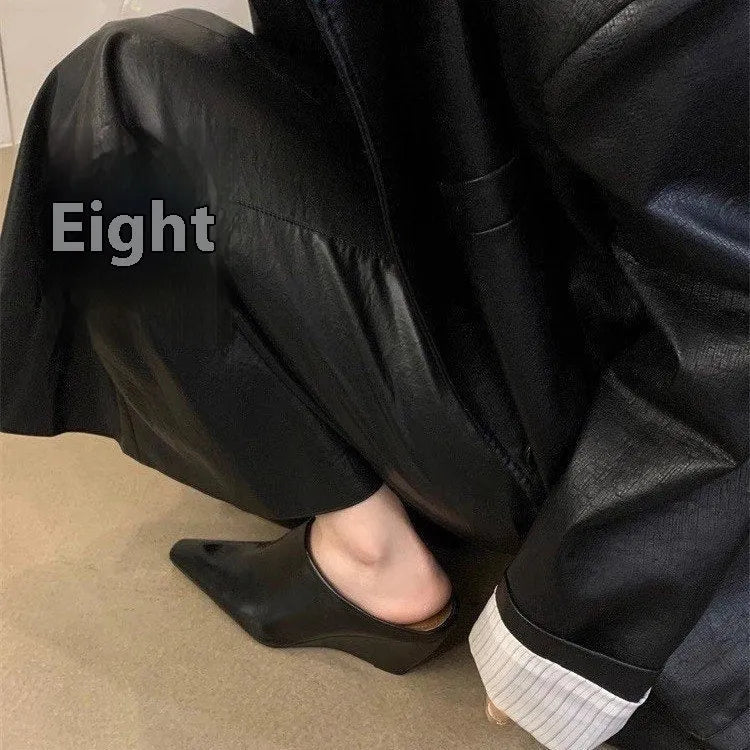 Women's black Wind Wedge closed toe half slippers with PU upper on a plain background.