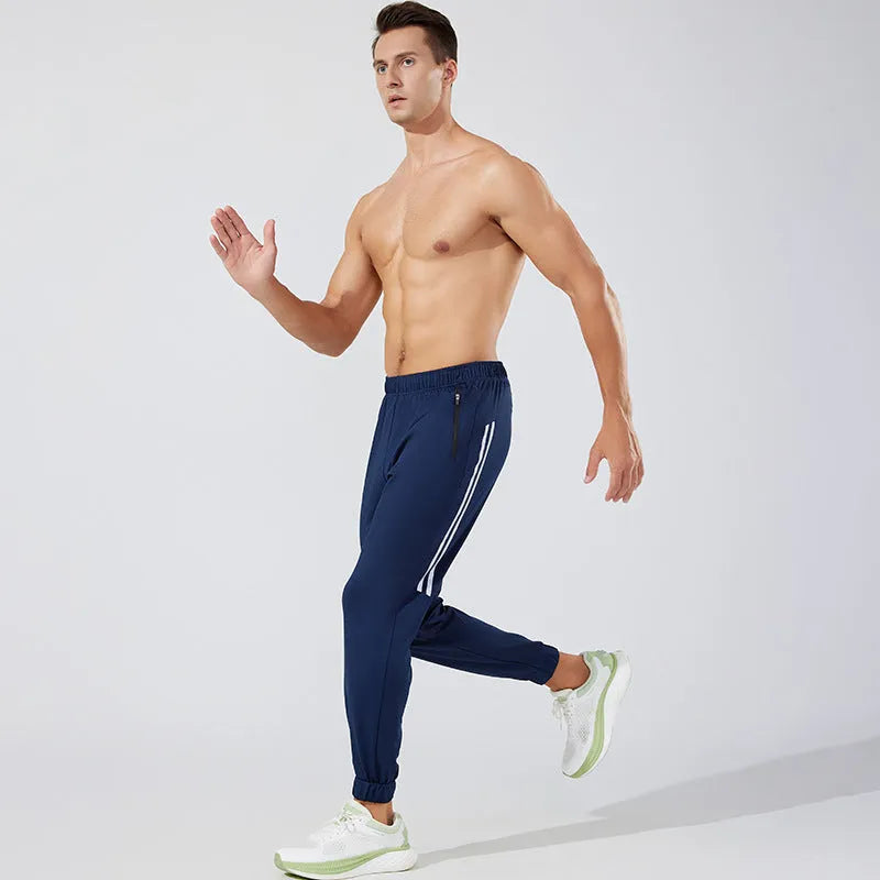 Men's black running trousers with mid-waist design and polyester construction for breathable sports performance