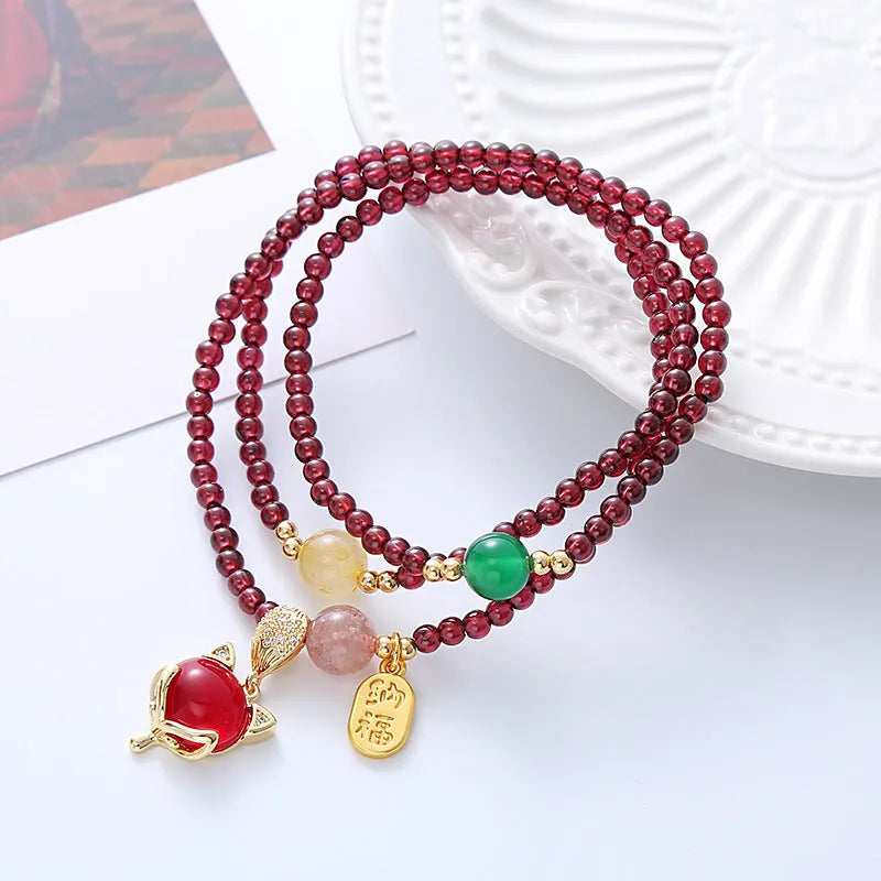 Purplish red garnet fox charm adjustable bracelet for women on rope cord