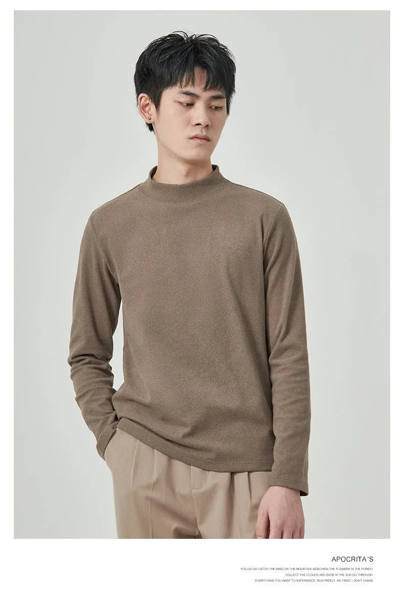 Man's brown long sleeve Dralon T-shirt with a half-high collar, laid flat.