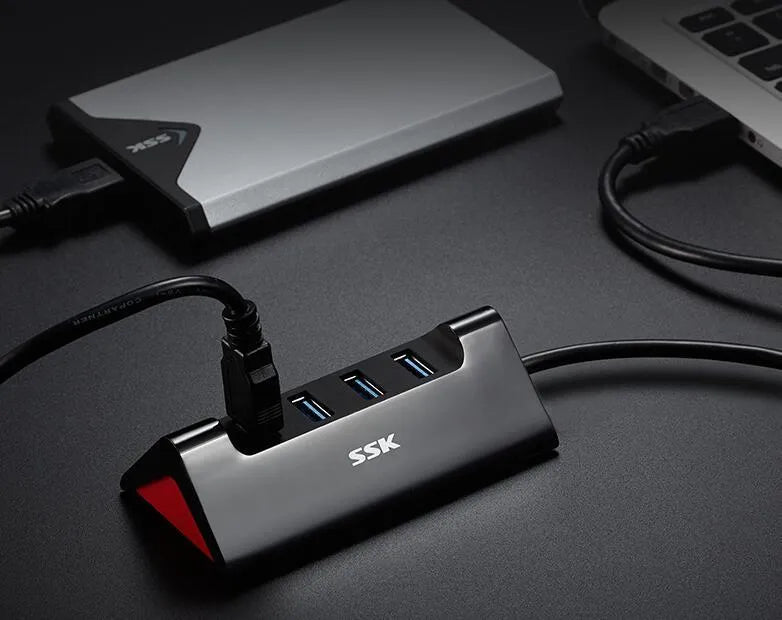 Black USB expansion dock with 4 ports and Micro USB power input on compact ABS plastic housing