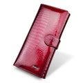 Women's leather purse with crocodile pattern design in wine red colour showing interior pigskin lining