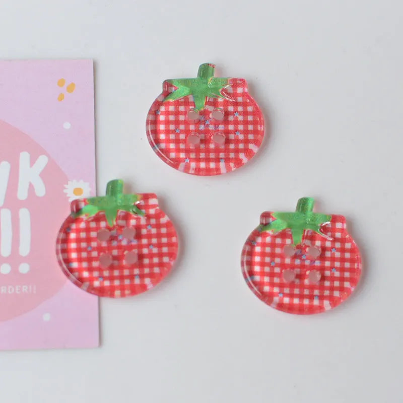 Medium size red tomato pattern button ornaments made from plastic resin, shown in different colour variations.