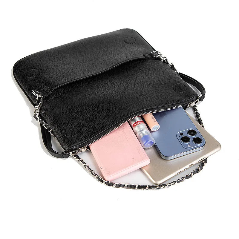Women's black shoulder messenger bag with chain detailing and organised interior compartments