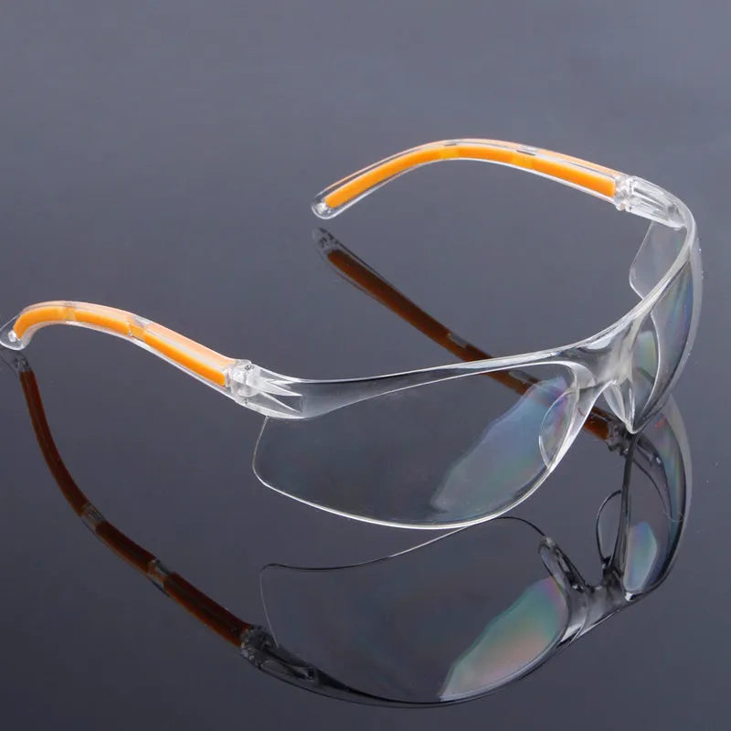 Transparent yellow safety goggles made of polycarbonate for eye protection.