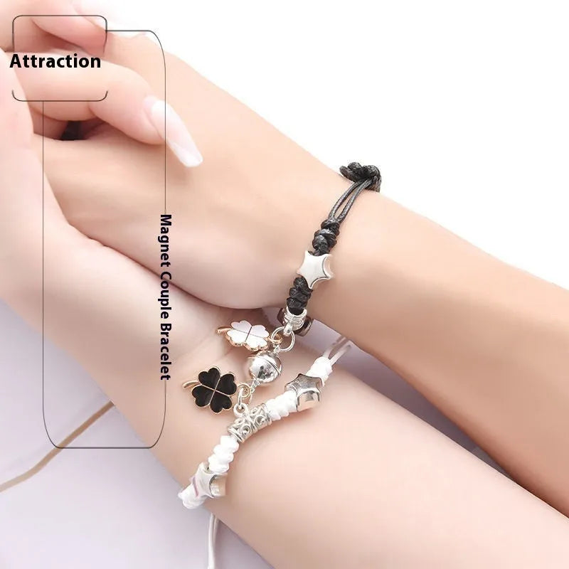 Pair of adjustable alloy bracelets with magnetic clasp showing detailed design of Crown and Clover styles
