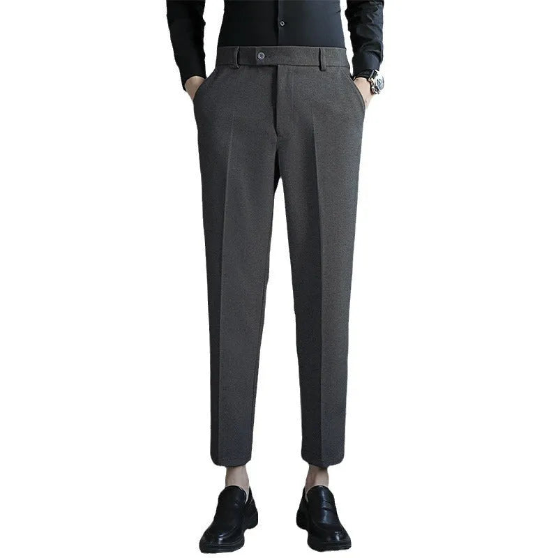 Straight leg brown corduroy trousers with an elasticated waistband on a hanger.