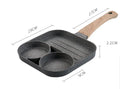 Aluminium four-hole non-stick frying pan with optional silicone spatula and brush on a hob