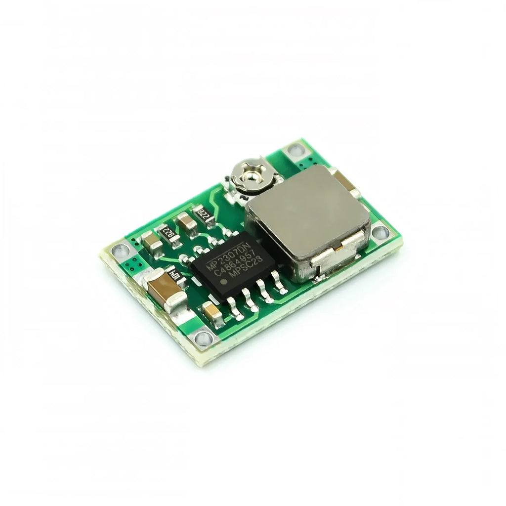Mini 360 green DC-DC buck converter step down power module on a white background