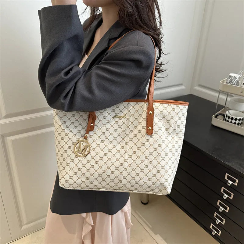 PU street style shoulder bag in black showing 42cm width and sewing thread detailing with polyester lining