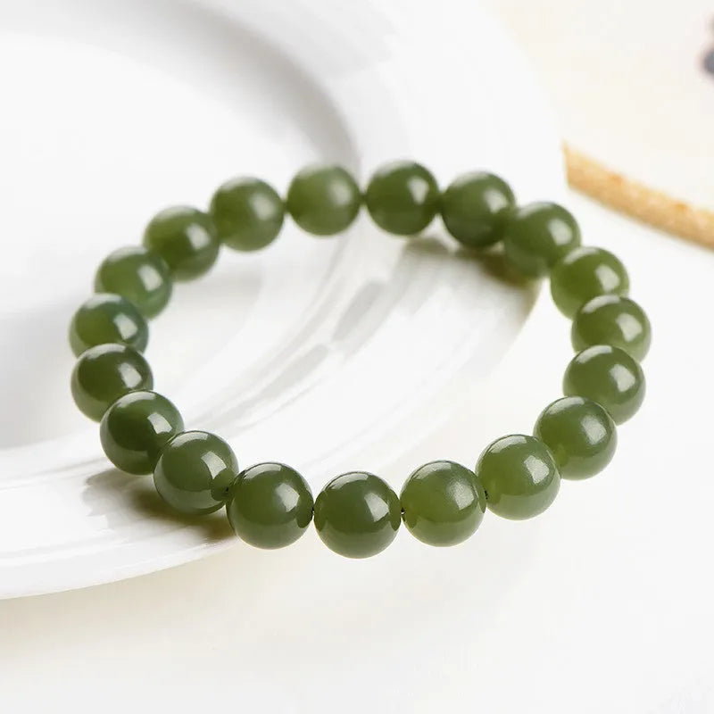 Hetian jade ball bracelet with polished beads in ice-like clear water colours, showing 4mm to 10mm size options