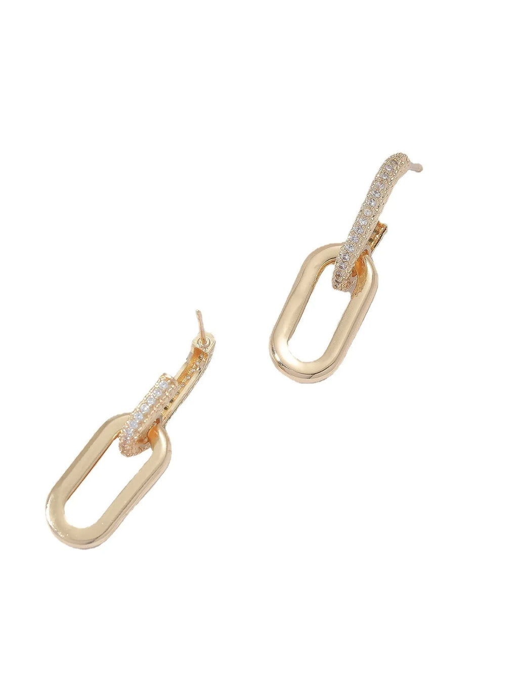 Pair of copper geometric ellipse earrings in 18K gold, silver, and rose gold finishes with diamond treatment