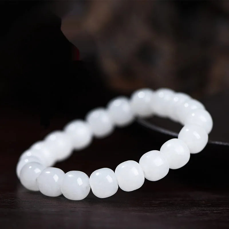 White jade barrel beads bracelet on wrist, showing Hetian jade beads in casual unisex design
