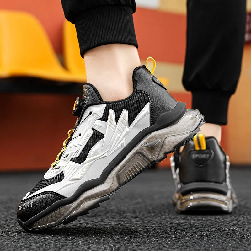Men's black rotating button dad shoes with mesh upper and non-slip sole on wooden surface