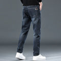 Blue grey slim straight loose casual thin trousers with micro elasticity, mid waist design, and zipper fly, shown on a model for summer wear.