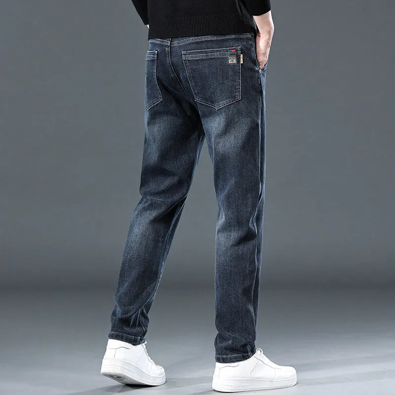 Blue grey slim straight loose casual thin trousers with micro elasticity, mid waist design, and zipper fly, shown on a model for summer wear.