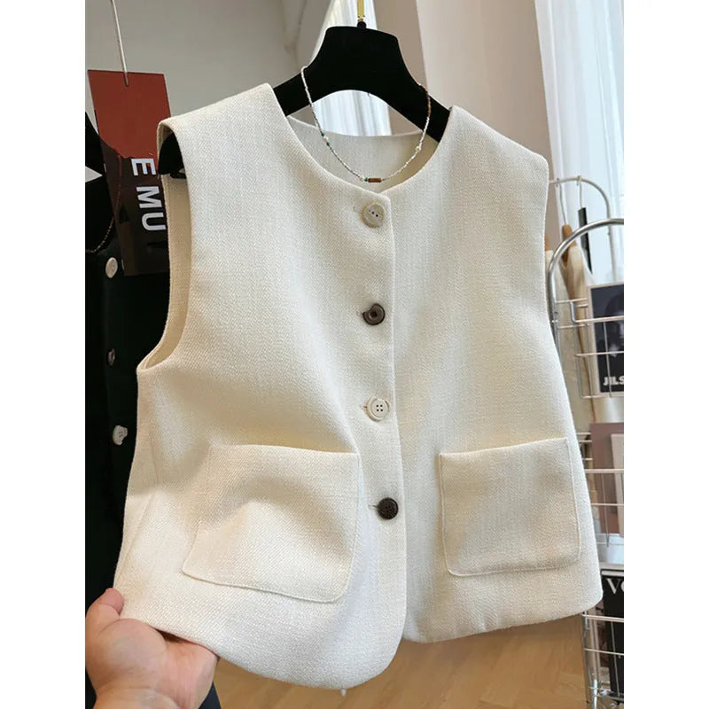 French style round neck sleeveless vest in milky white colour, showing bandage-style construction and polyester fabric texture