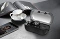 Black wireless TWS in-ear sports headphones with a compact rectangular charging case on a white background.
