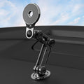 Black magnetic car phone holder with dashboard clip for secure smartphone mounting during driving