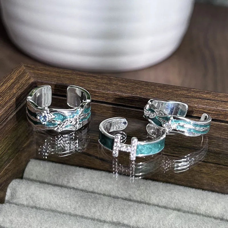 Mint green enamel eight-point asterism ring with irregular folding copper design