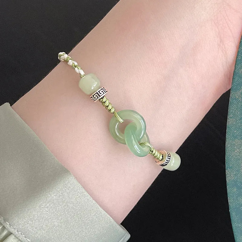 Green jade double ring strap bracelet with peace buckle and animal zodiac design in electroplated copper