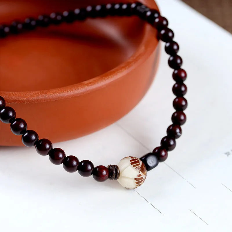 Natural rosewood double-ring bracelet with floral shape design measuring 10mm width