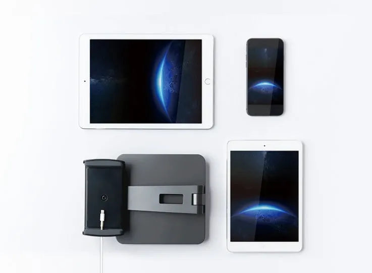 Silver foldable desktop holder supporting tablet with 360° rotation mechanism visible