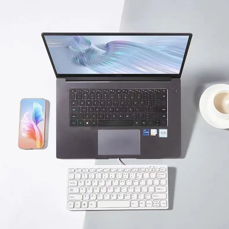USB wired mini keyboard measuring 280x125mm with 1.3m cable in black, white, pink or blue colour options