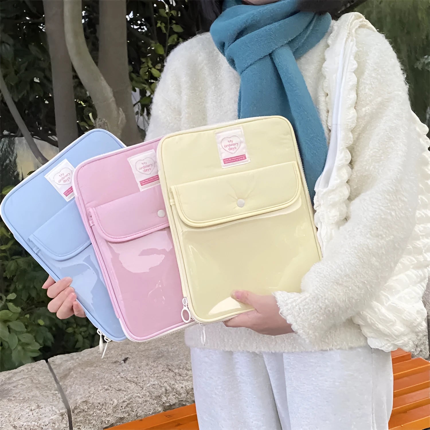 Nylon snap pocket laptop bag for 11-inch or 13-inch tablets in colours white, yellow, black, blue, and lotus root.